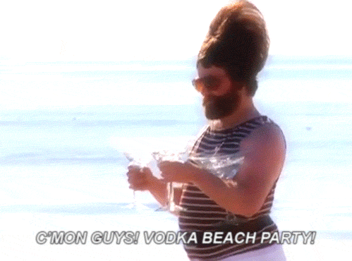 gif of man walking on beach with vodka